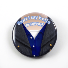 A clever bust portrait by Camie M. Anderson of Captain Jack Harkness from Doctor Who saying his memorable quote Can't I say hello to anyone? on a handmade button