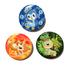 A set of three unique buttons featuring the Sinnoh starters from Pokemon