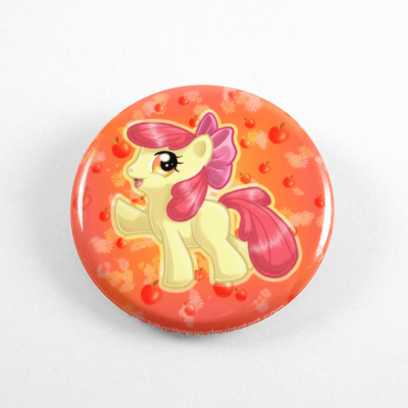 A cute chibi drawing by Camie M. Anderson of Applebloom from My Little Pony on a handmade button
