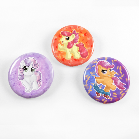 A set of three cute chibi drawings of the Cutie Mark Crusaders on a set of handmade buttons