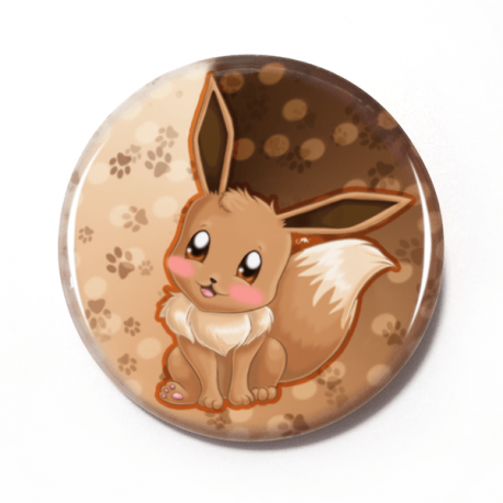 A cute chibi drawing by Camie M. Anderson of Eevee from Pokemon on a handmade button