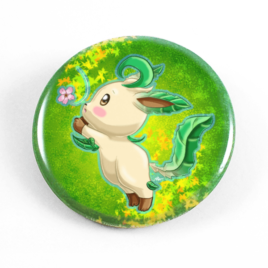 A cute chibi drawing by Camie M. Anderson of Leafeon from Pokemon on a handmade button