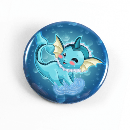 A cute chibi drawing by Camie M. Anderson of Vaporeon from Pokemon on a handmade button