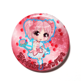 A cute chibi version of Madoka Kaname from Puella Magi Madoka Magica drawn by Camie M. Anderson on a handmade button