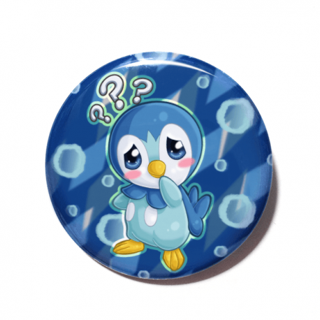 A cute chibi version of Piplup from Pokemon drawn by Camie M. Anderson on a handmade button